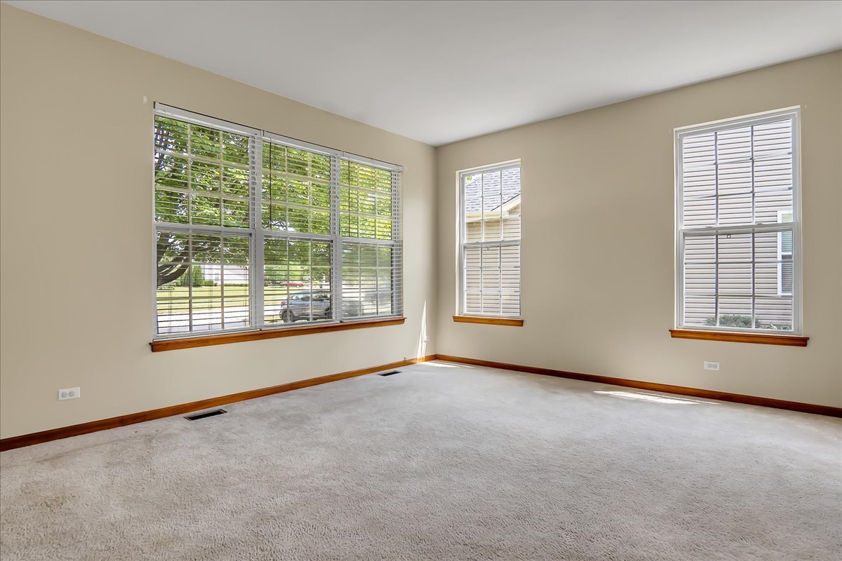 255 Hampton Road Sugar Grove, IL 60554 - Photo 3 of 28 a view of an empty room with a window