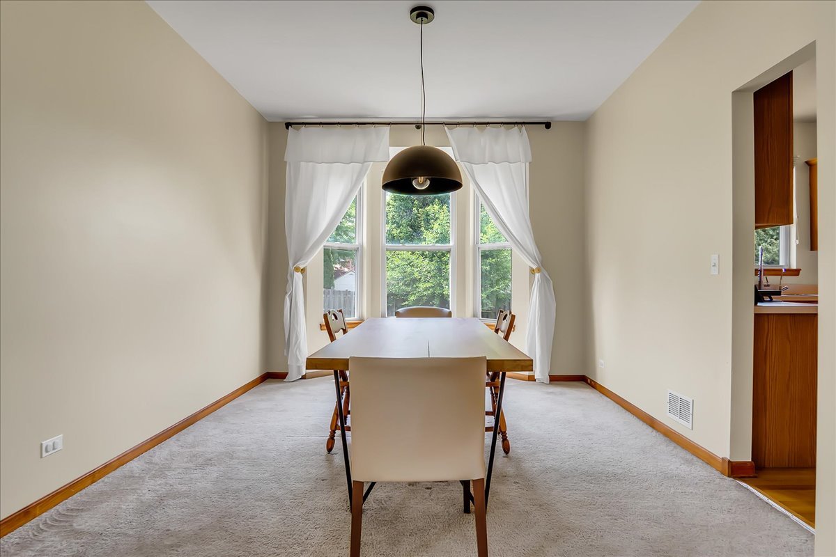 255 Hampton Road Sugar Grove, IL 60554 - Photo 5 of 28 a living room with a window and a table