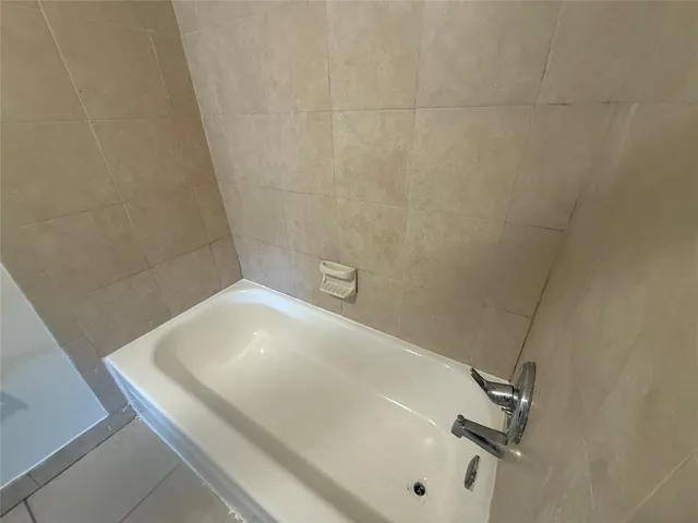 a bath tub sitting in a bathroom