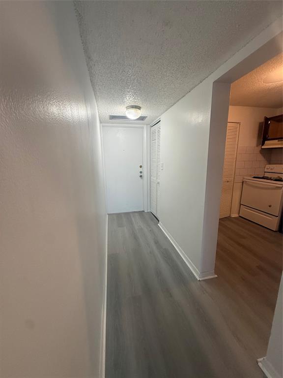 7960 North Colony Circle Tamarac, FL 33321 - Photo 4 of 11 a view of hallway with wooden floor
