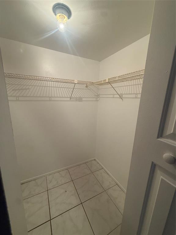 7960 North Colony Circle Tamarac, FL 33321 - Photo 7 of 11 a view of a room with racks on the wall