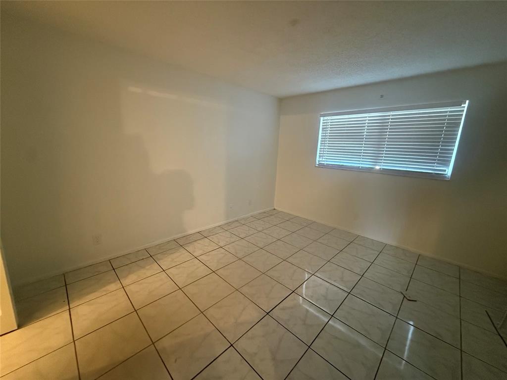 7960 North Colony Circle Tamarac, FL 33321 - Photo 10 of 11 a view of a room and utility room