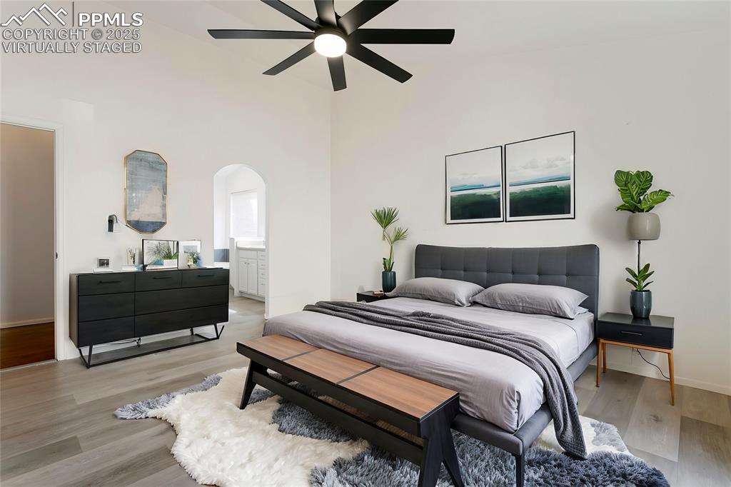 8946 Oakmont Road Peyton, CO 80831 - Photo 17 of 35 a bedroom with a bed and wooden floor