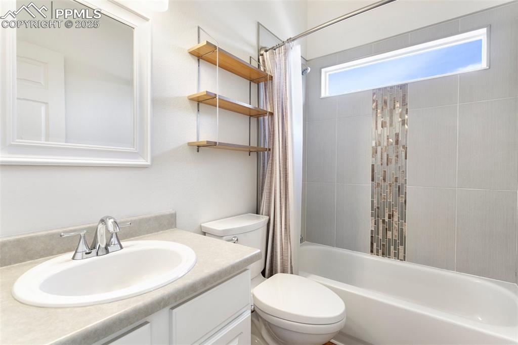 8946 Oakmont Road Peyton, CO 80831 - Photo 24 of 35 a bathroom with a sink toilet and shower