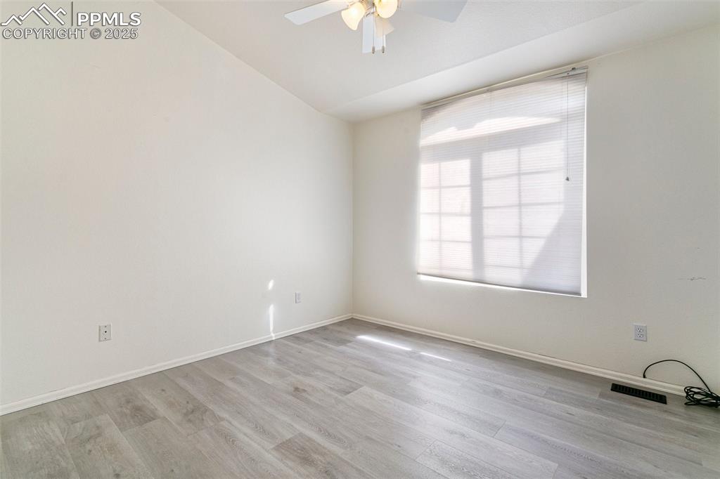 8946 Oakmont Road Peyton, CO 80831 - Photo 26 of 35 an empty room with a window and a ceiling fan