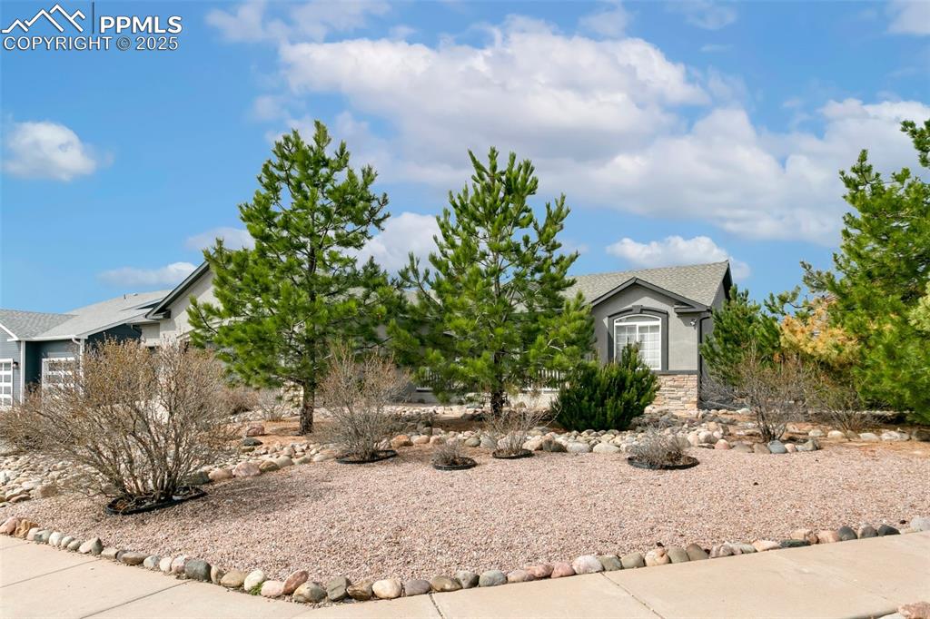 8946 Oakmont Road Peyton, CO 80831 - Photo 3 of 35 a view of a house with a yard