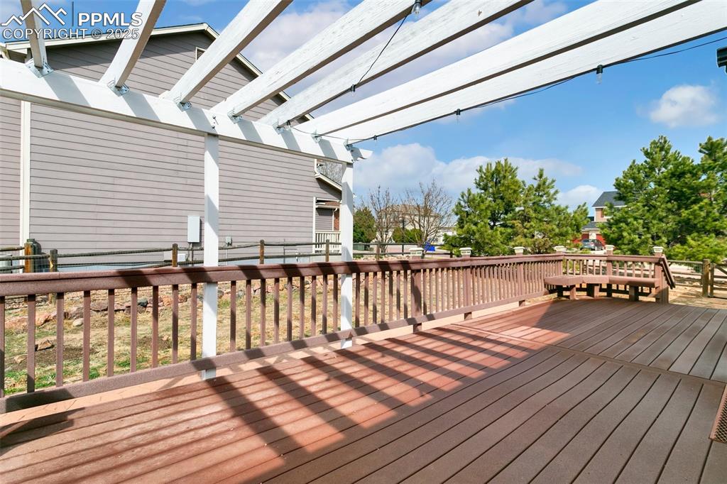 8946 Oakmont Road Peyton, CO 80831 - Photo 33 of 35 a balcony with wooden floor and city view