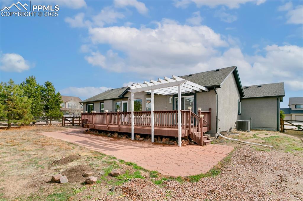 8946 Oakmont Road Peyton, CO 80831 - Photo 34 of 35 a view of a house with a yard and wooden fence