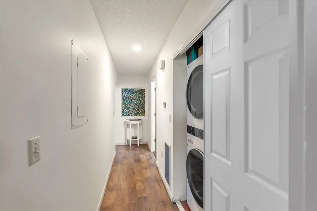 a view of a hallway with washer and dryer
