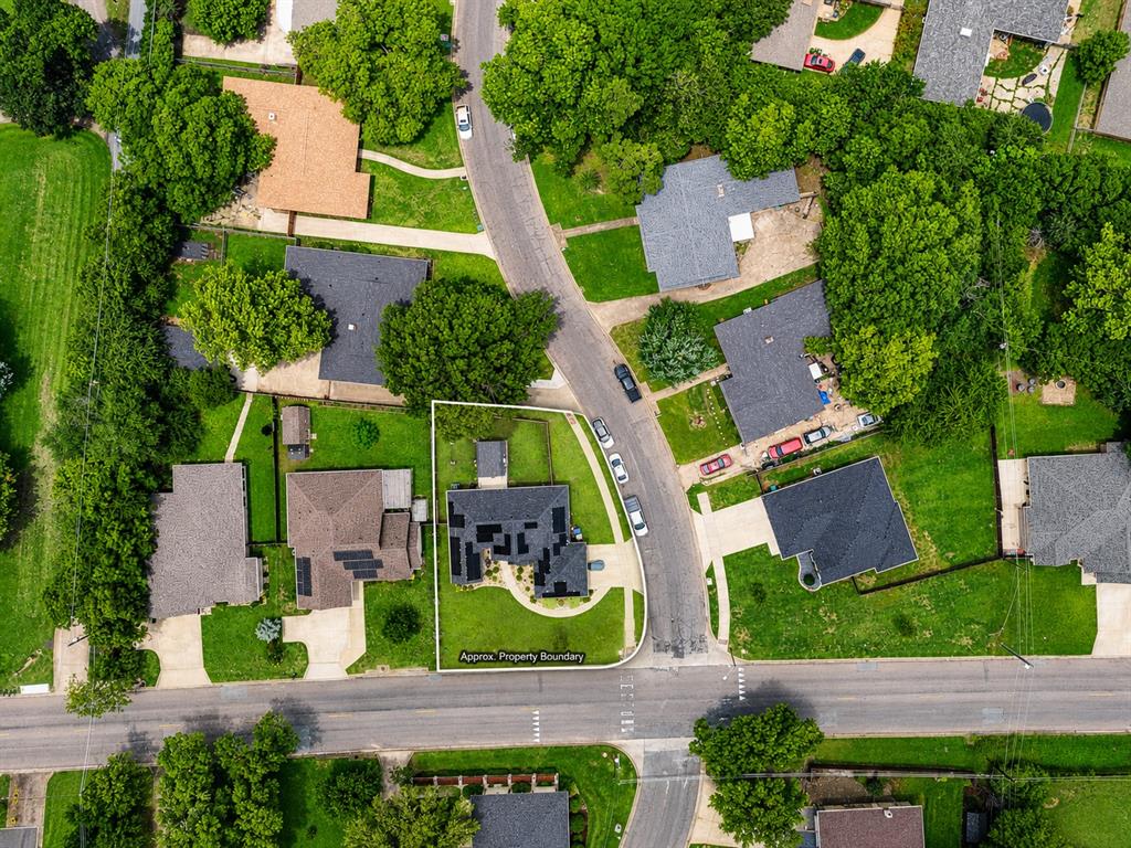 701 West Lamberth Road Sherman, TX 75092 - Photo 35 of 37 Aerial view showcasing a residential property with an asphalt shingle roof