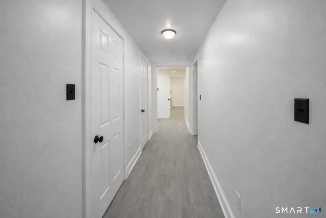 a view of a bathroom from the hallway