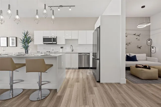 a view of a balcony with chair and iron fence