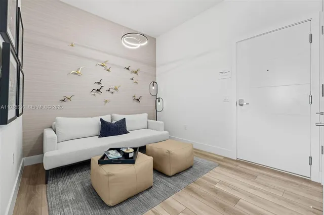 a bathroom with a sink shower and a mirror