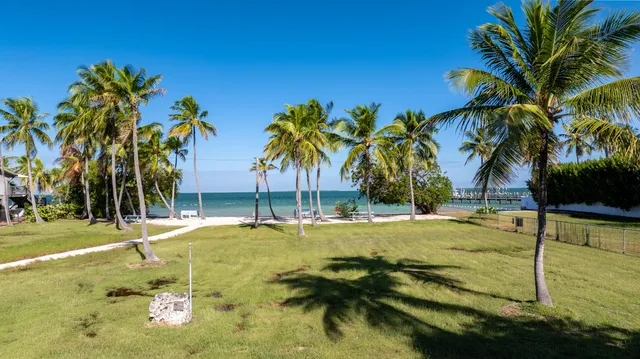 a view of swimming pool with a table and chairs