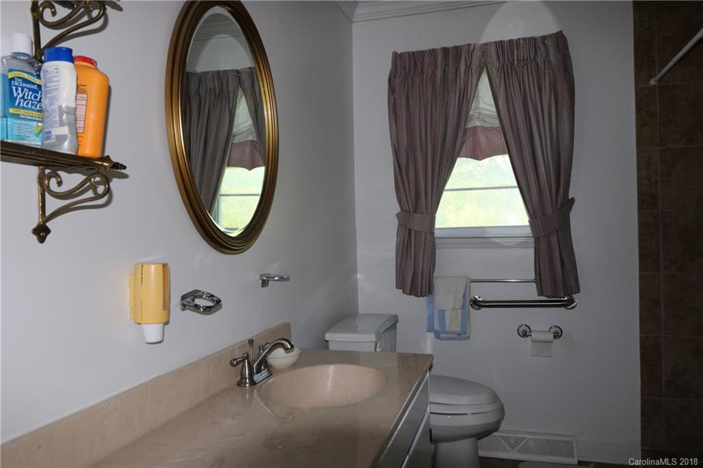 503 Roy Eaker Road Cherryville, NC 28021 - Photo 11 of 17 a bathroom with a sink and a mirror