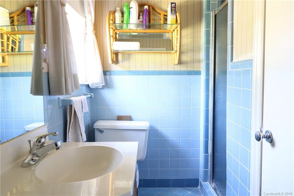 503 Roy Eaker Road Cherryville, NC 28021 - Photo 13 of 17 a bathroom with a tub sink and mirror