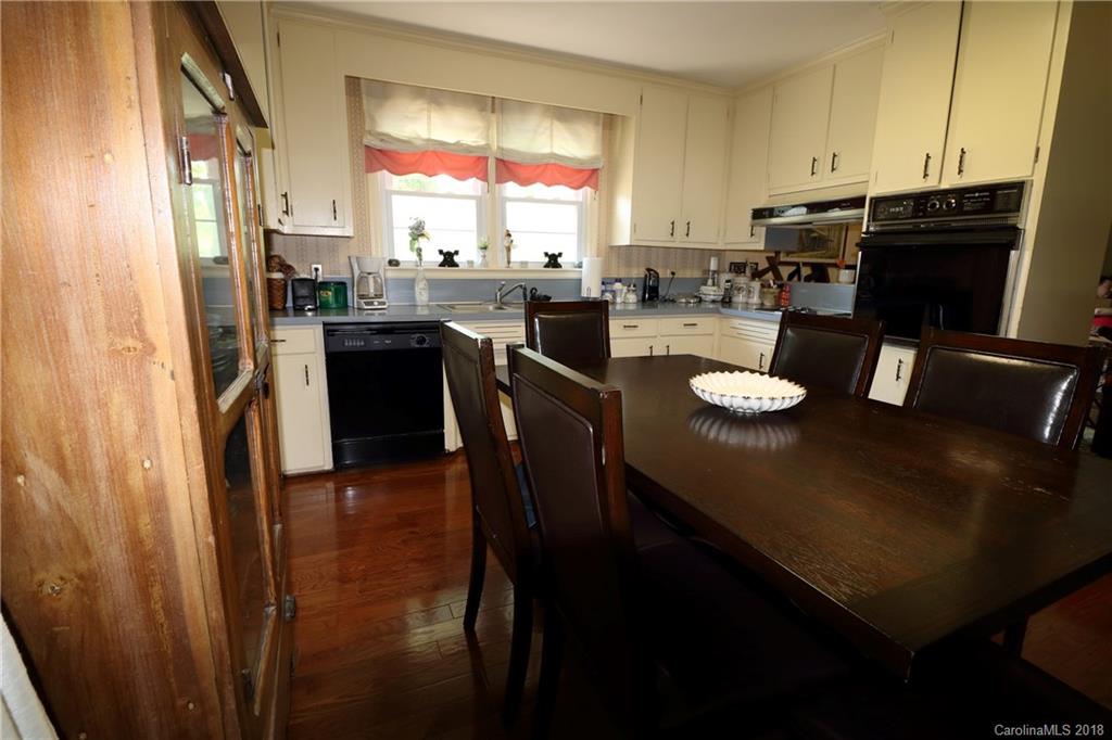 503 Roy Eaker Road Cherryville, NC 28021 - Photo 6 of 17 a kitchen with a table chairs and refrigerator