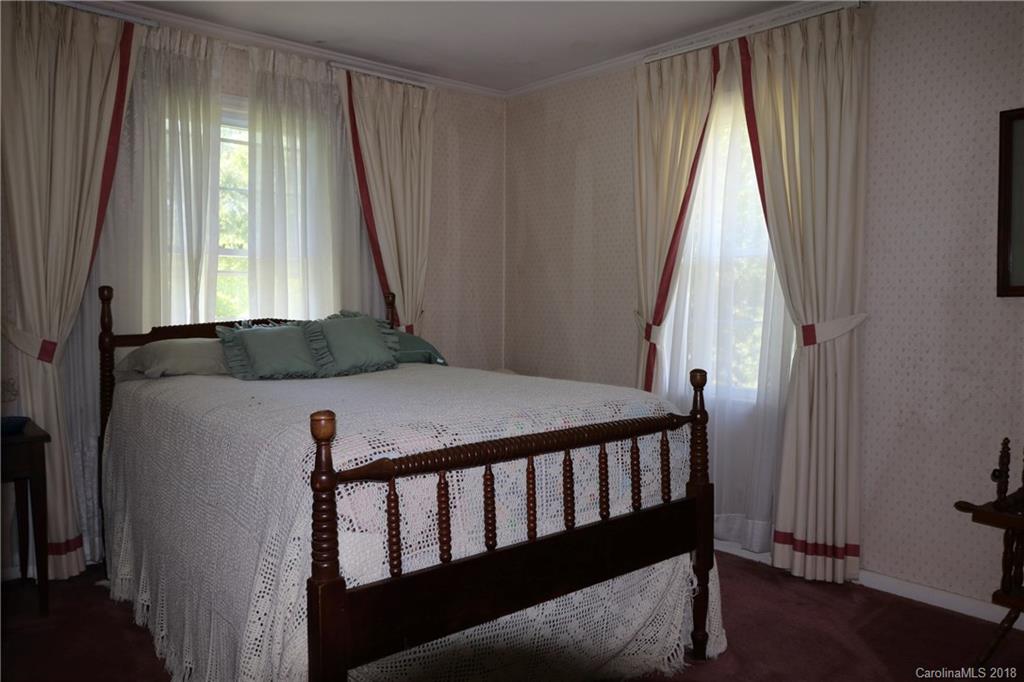 503 Roy Eaker Road Cherryville, NC 28021 - Photo 8 of 17 a view of a bedroom with window and stairs