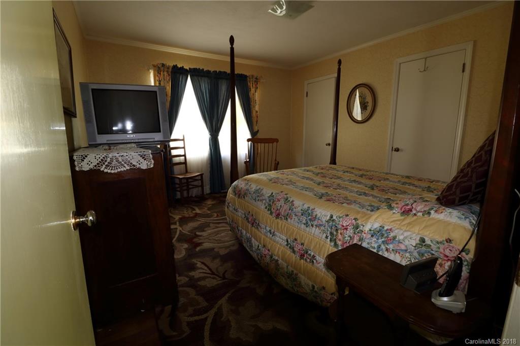 503 Roy Eaker Road Cherryville, NC 28021 - Photo 10 of 17 a bedroom with a bed and a mirror