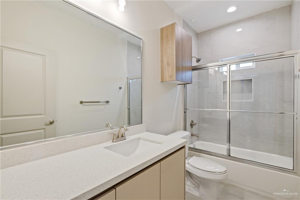 1806 West Violet Drive, Unit 1 Pharr, TX 78577 - Photo 9 of 15 a bathroom with a sink toilet and shower