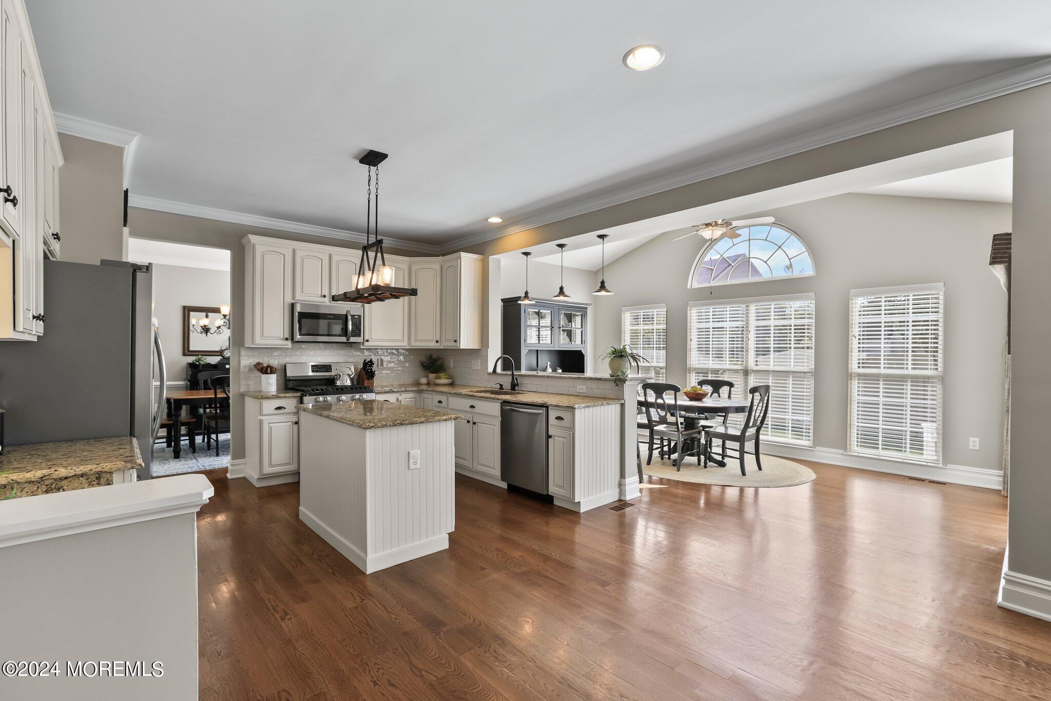 24 Firestone Drive Howell, NJ 07731 - Photo 12 of 70 a kitchen with sink cabinets and wooden floor