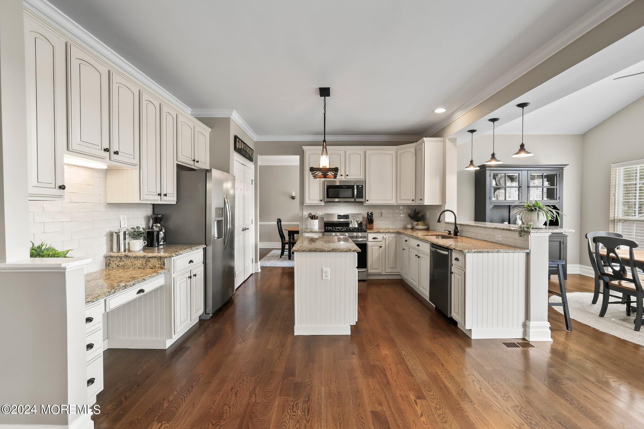 24 Firestone Drive Howell, NJ 07731 - Photo 13 of 70 a kitchen with stove a sink and white appliances