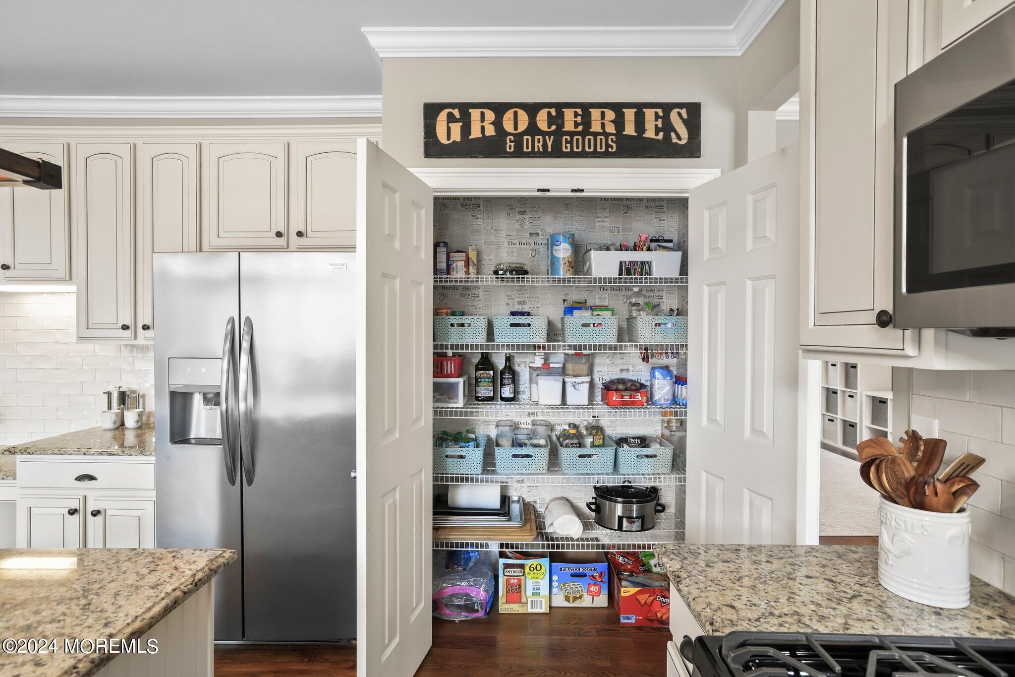 24 Firestone Drive Howell, NJ 07731 - Photo 18 of 70 a kitchen with stainless steel appliances granite countertop a refrigerator and a stove
