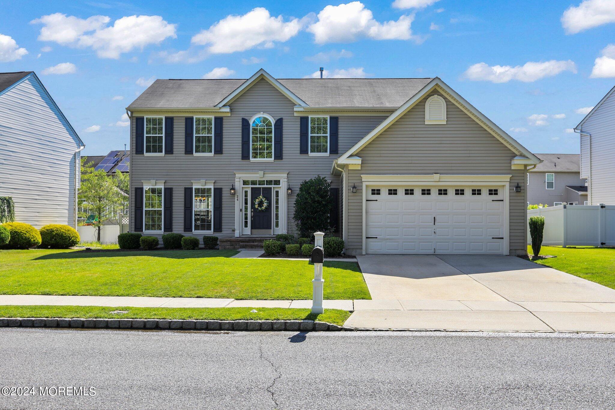 24 Firestone Drive Howell, NJ 07731 - Photo 2 of 70 a white house with a large pool in front of it