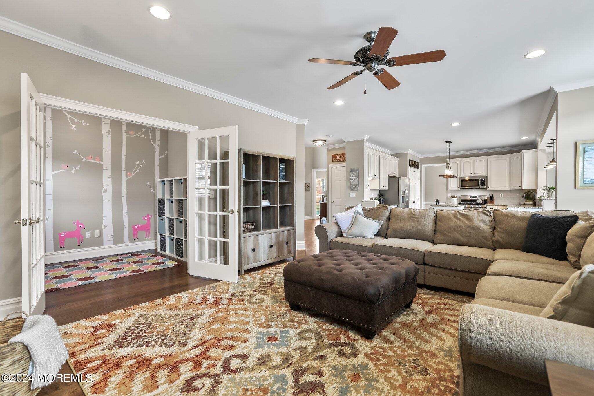 24 Firestone Drive Howell, NJ 07731 - Photo 24 of 70 a living room with furniture ceiling fan and a rug