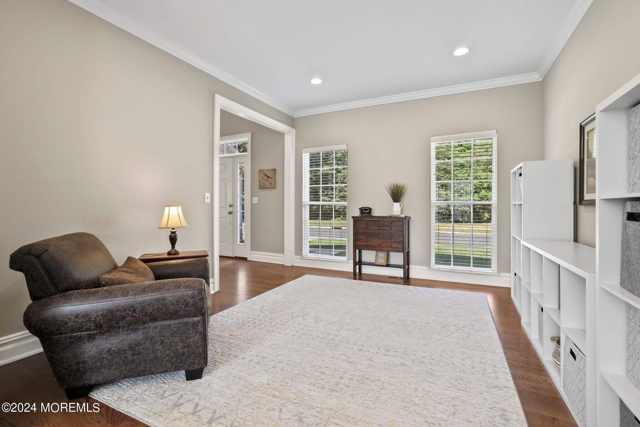24 Firestone Drive Howell, NJ 07731 - Photo 28 of 70 a living room with furniture and a table