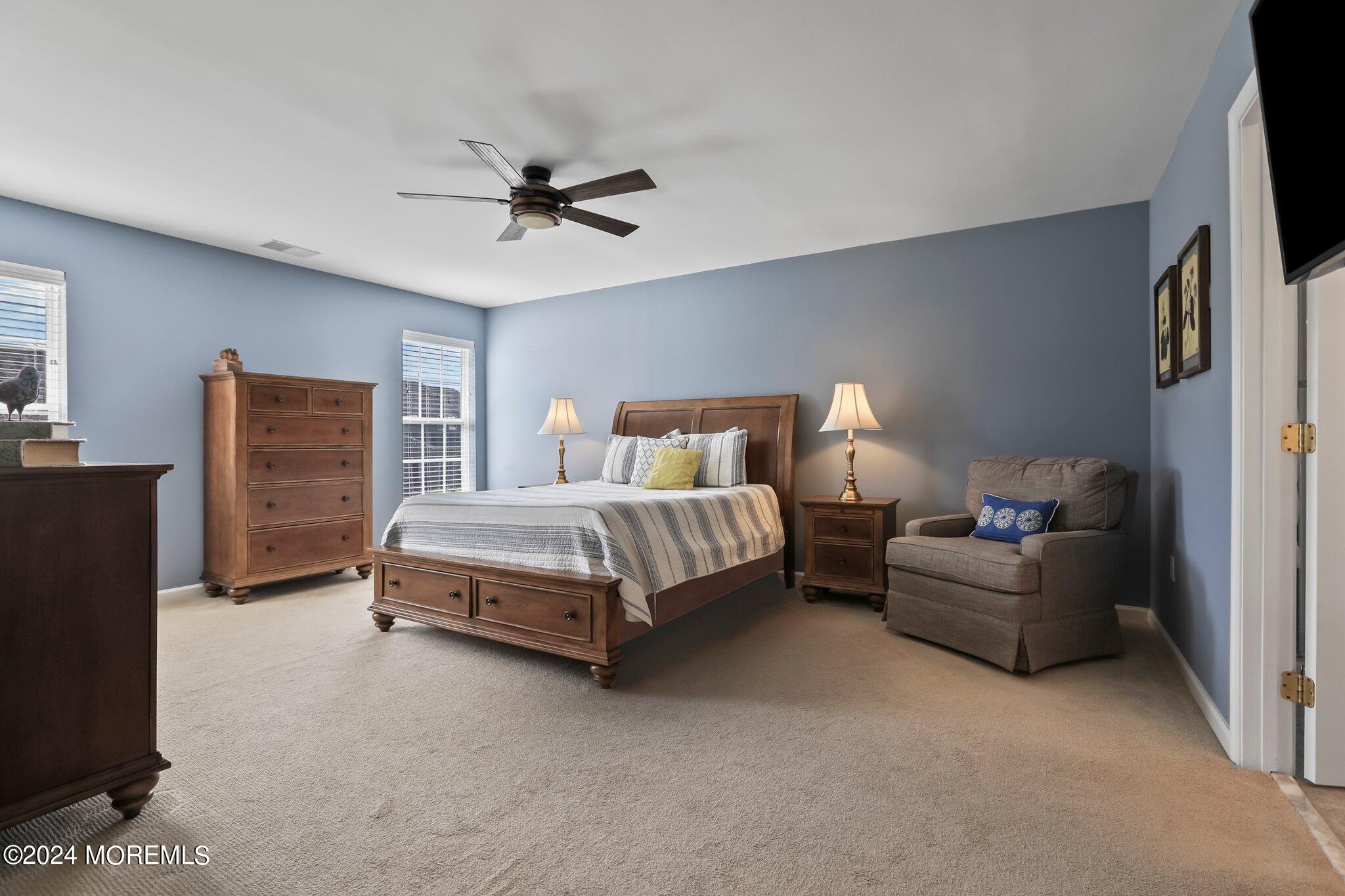 24 Firestone Drive Howell, NJ 07731 - Photo 36 of 70 a bedroom with a bed and a flat screen television