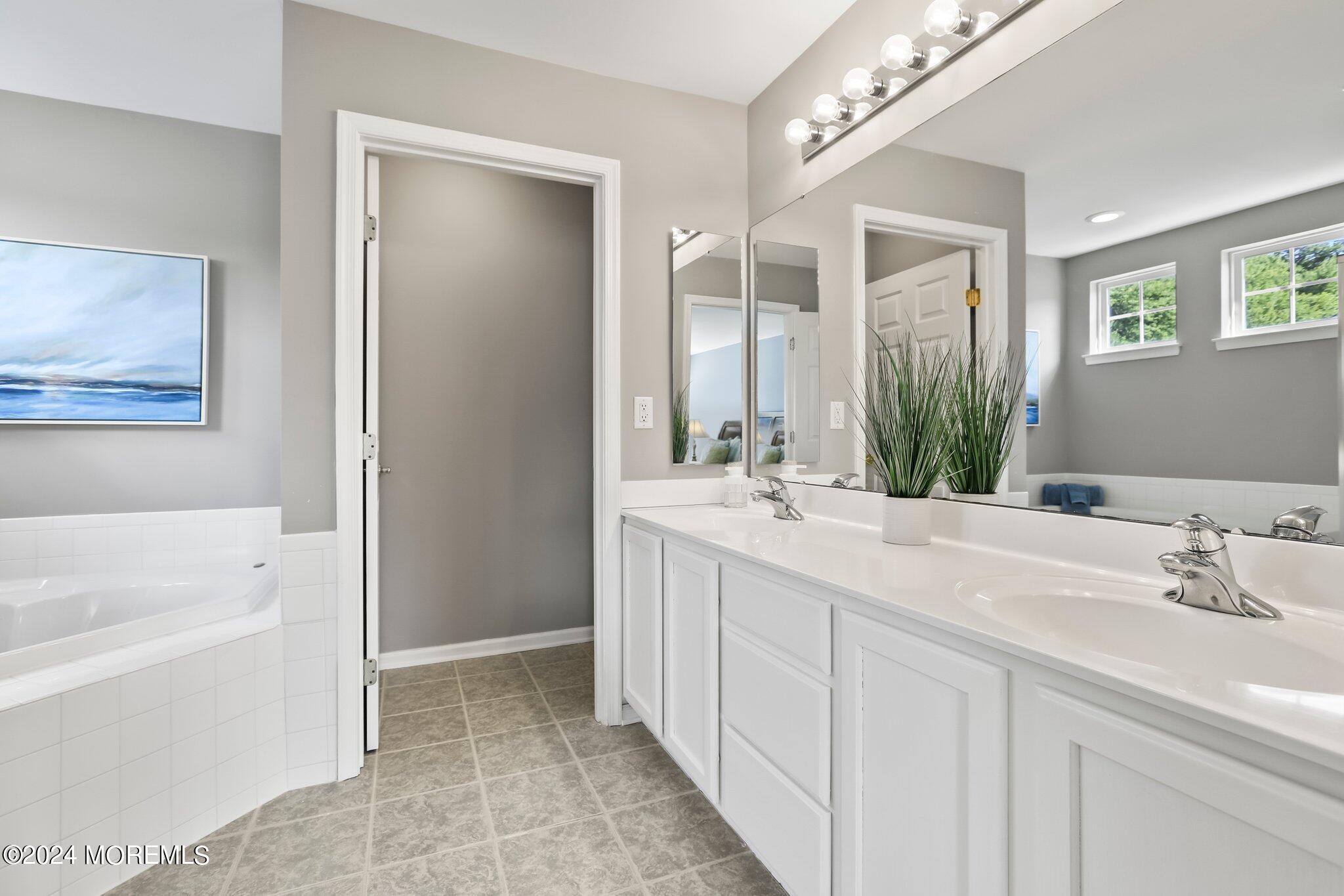 24 Firestone Drive Howell, NJ 07731 - Photo 38 of 70 a bathroom with a double vanity sink mirror and bathtub