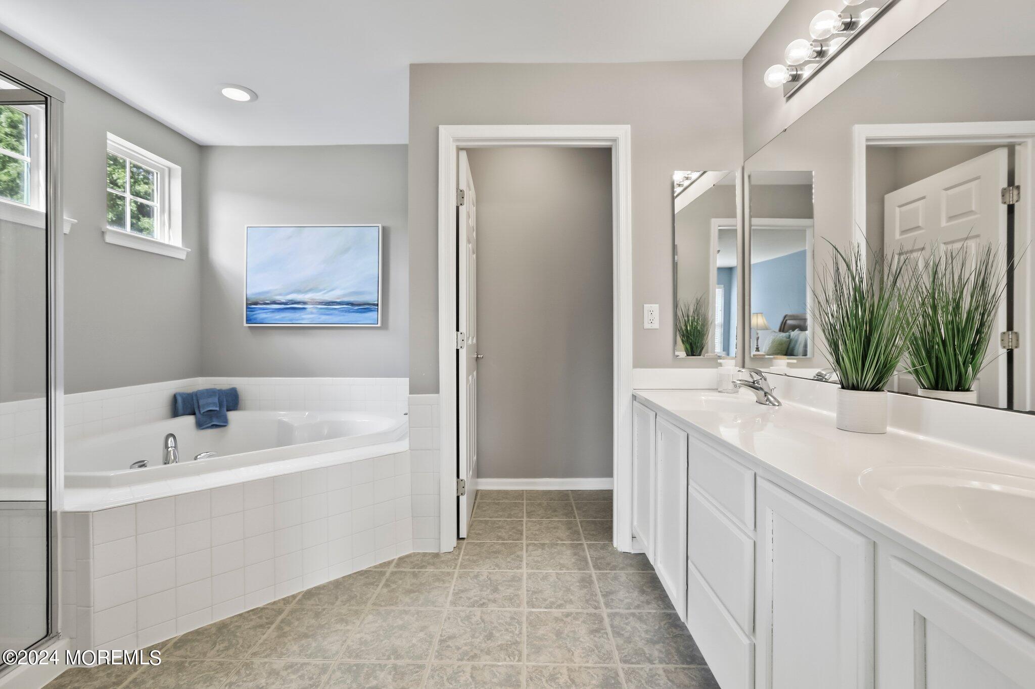 24 Firestone Drive Howell, NJ 07731 - Photo 39 of 70 a bathroom with a double vanity sink mirror and bathtub