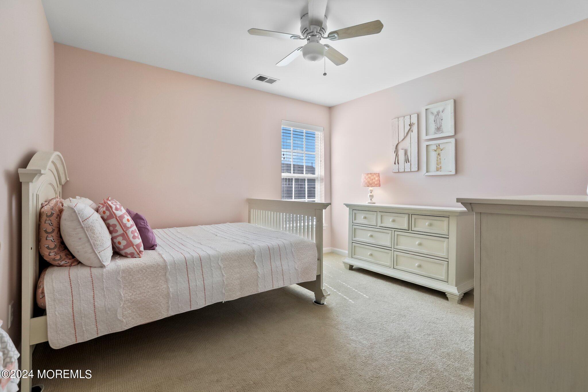 24 Firestone Drive Howell, NJ 07731 - Photo 44 of 70 a living room with furniture and a dresser