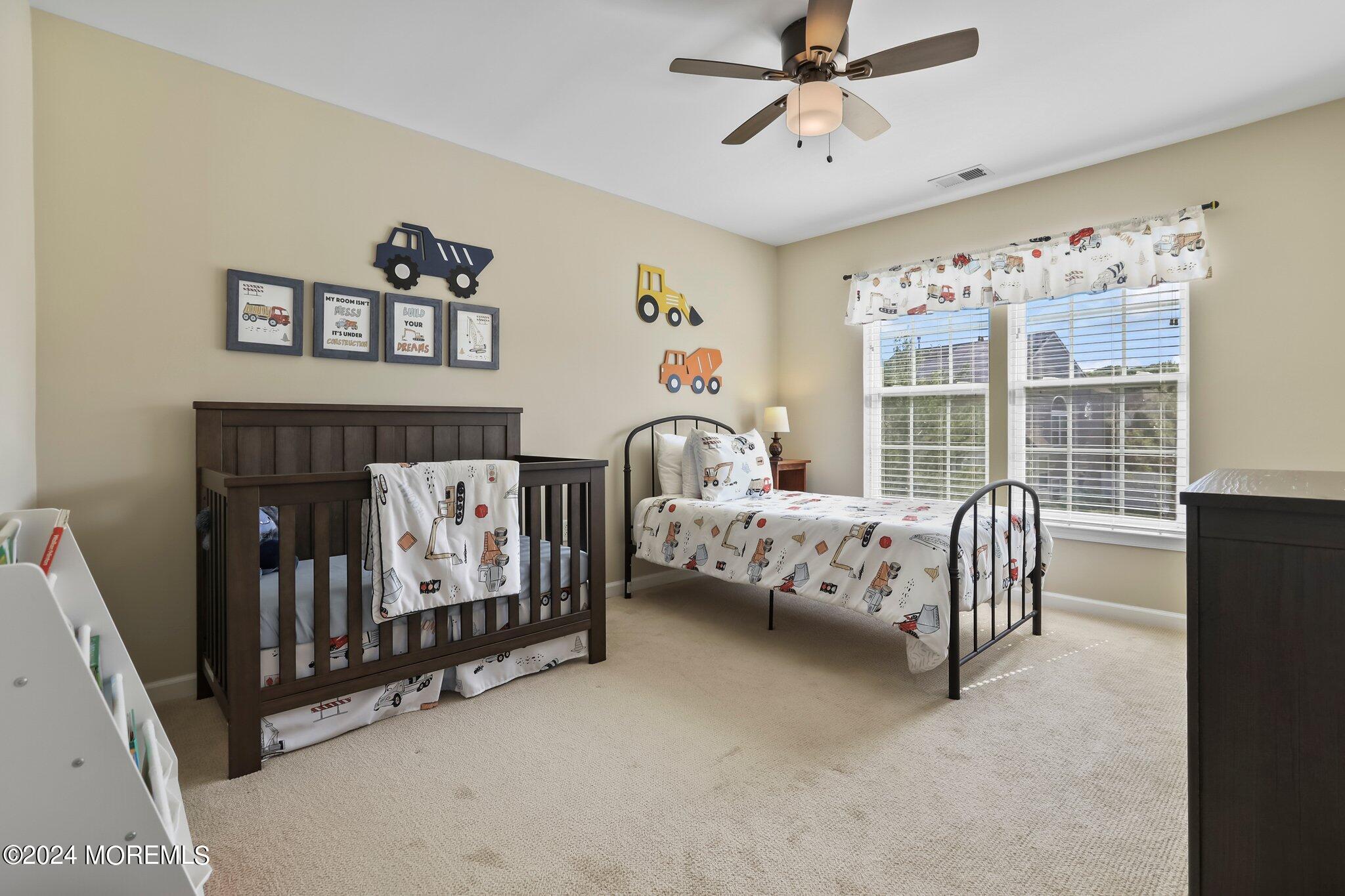 24 Firestone Drive Howell, NJ 07731 - Photo 45 of 70 a bedroom with a bed and a window