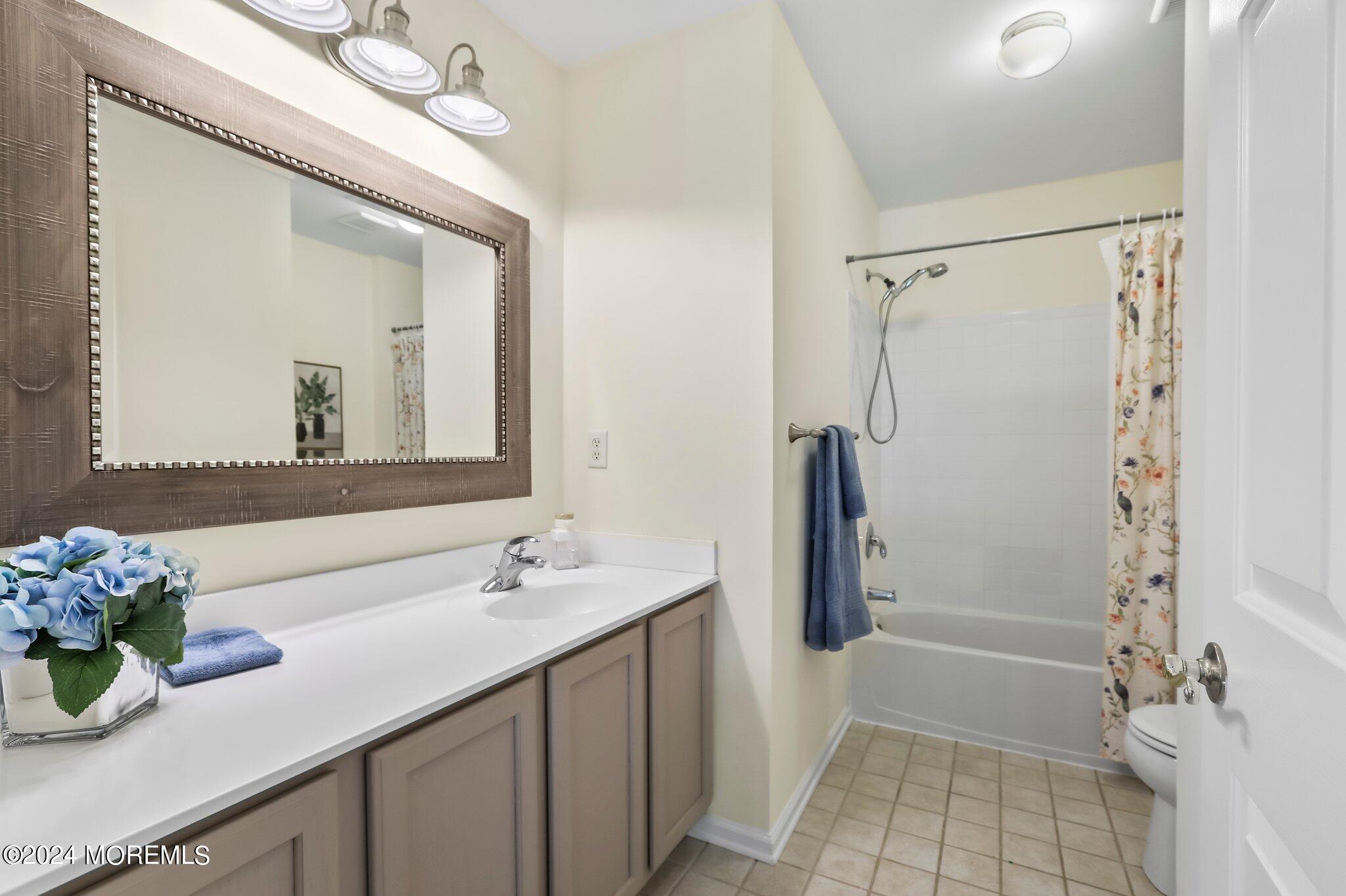 24 Firestone Drive Howell, NJ 07731 - Photo 47 of 70 a bathroom with a double vanity sink mirror and shower