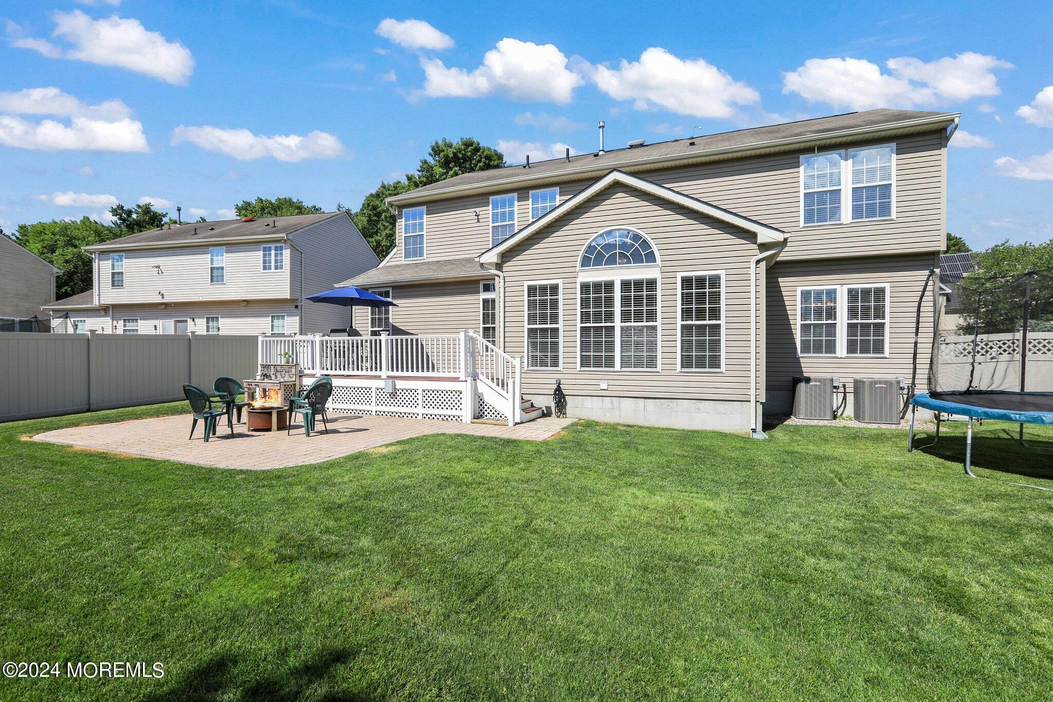 24 Firestone Drive Howell, NJ 07731 - Photo 52 of 70 a view of a house with a yard and sitting area
