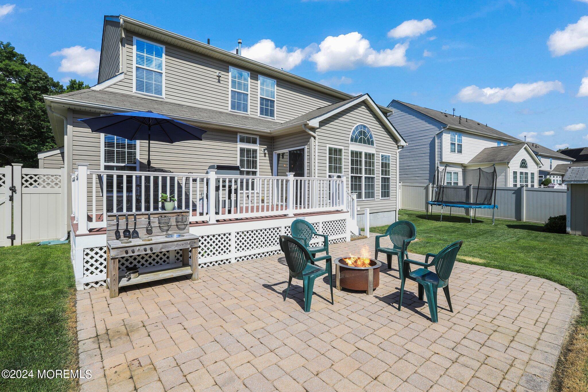 24 Firestone Drive Howell, NJ 07731 - Photo 53 of 70 a view of a house with a yard and furniture