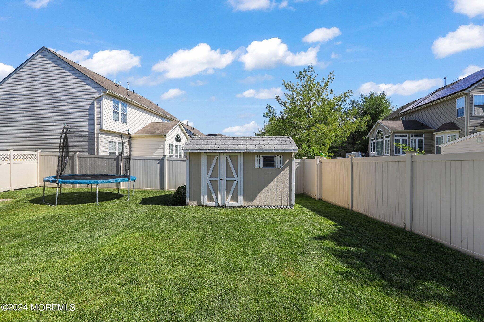 24 Firestone Drive Howell, NJ 07731 - Photo 57 of 70 a view of a house with a yard and sitting area
