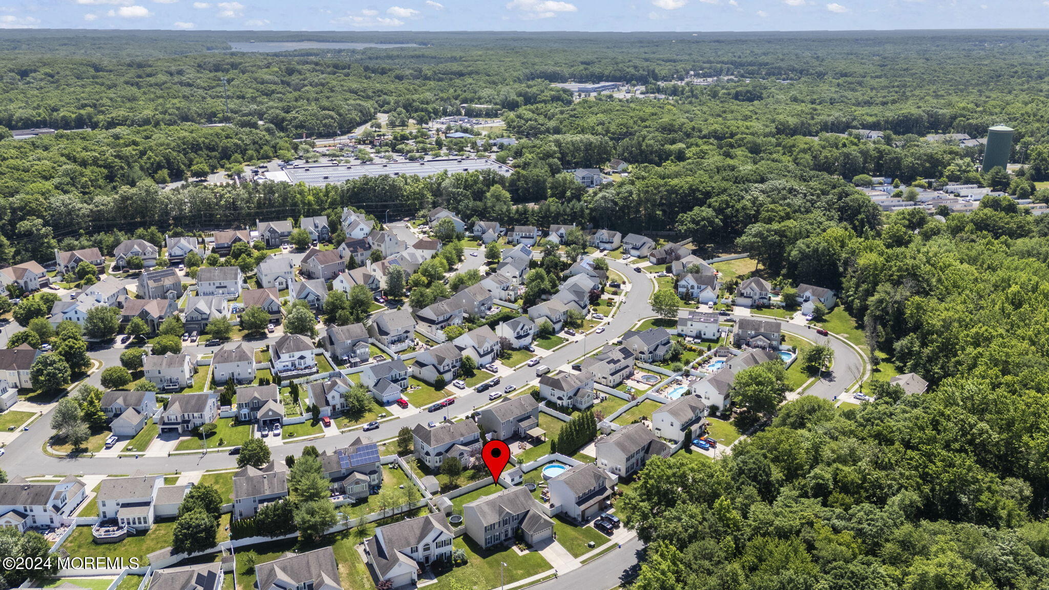 24 Firestone Drive Howell, NJ 07731 - Photo 61 of 70 an aerial view of a houses with a yard and lake view