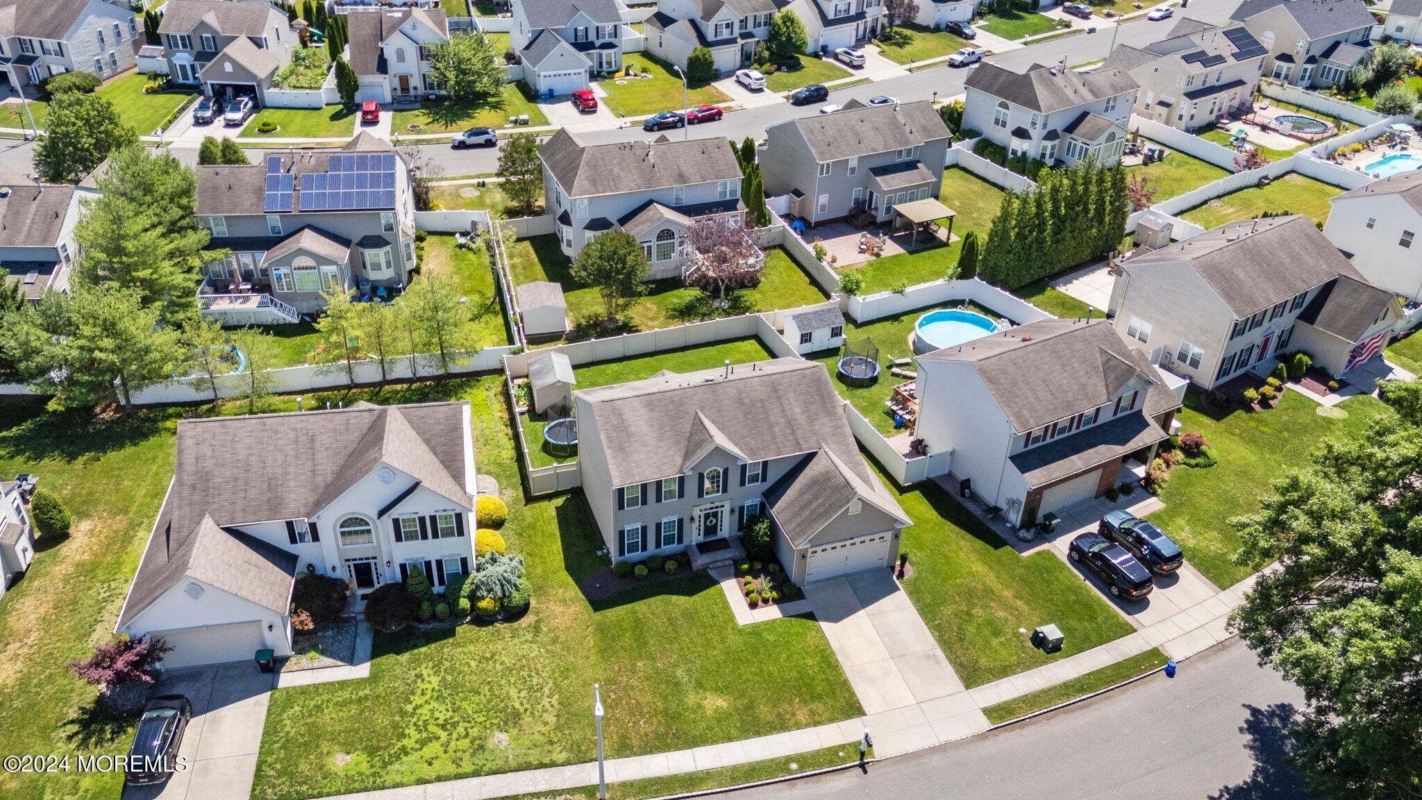 24 Firestone Drive Howell, NJ 07731 - Photo 64 of 70 an aerial view of houses with outdoor space and swimming pool