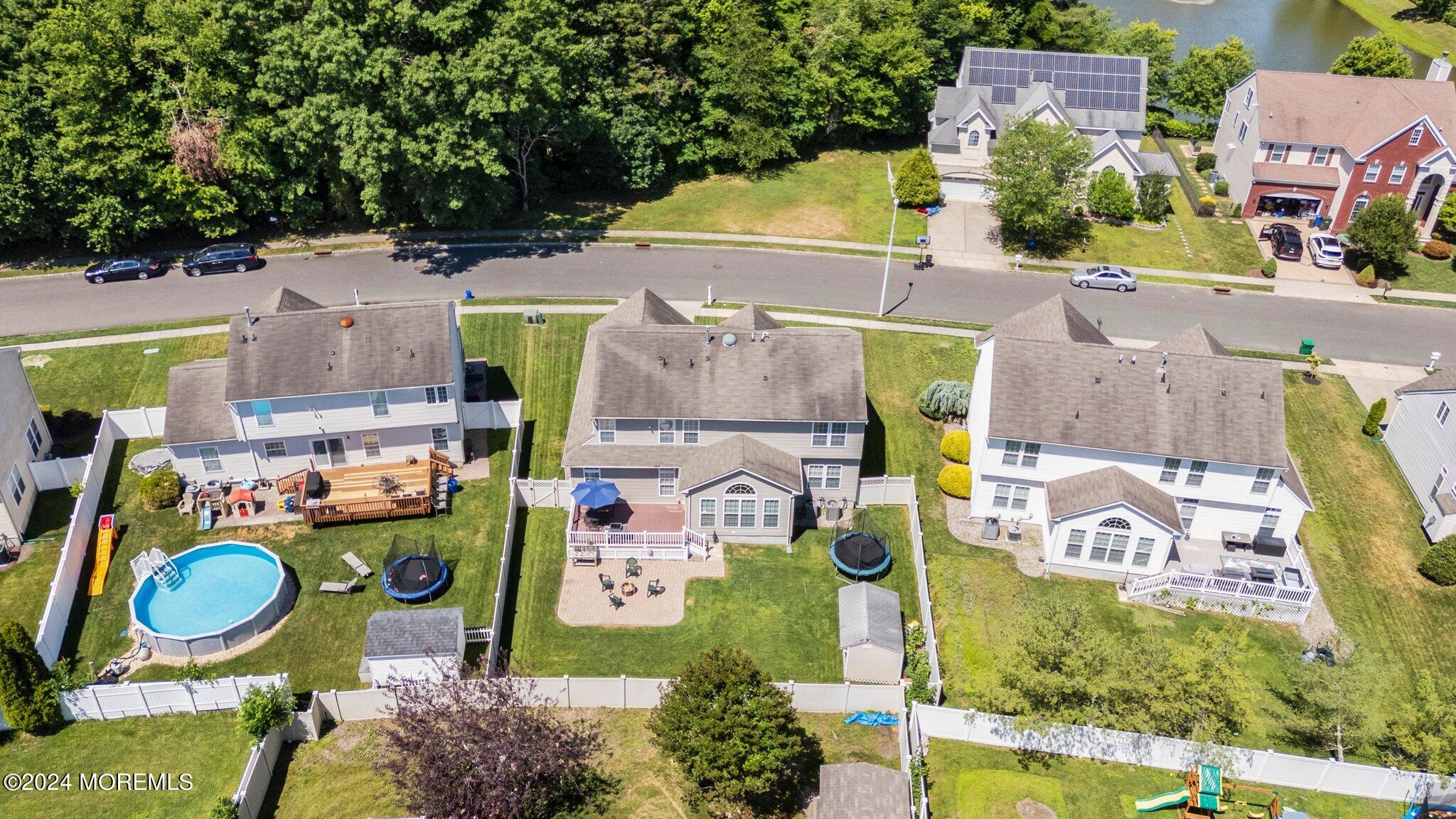 24 Firestone Drive Howell, NJ 07731 - Photo 65 of 70 an aerial view of residential houses with outdoor space and parking