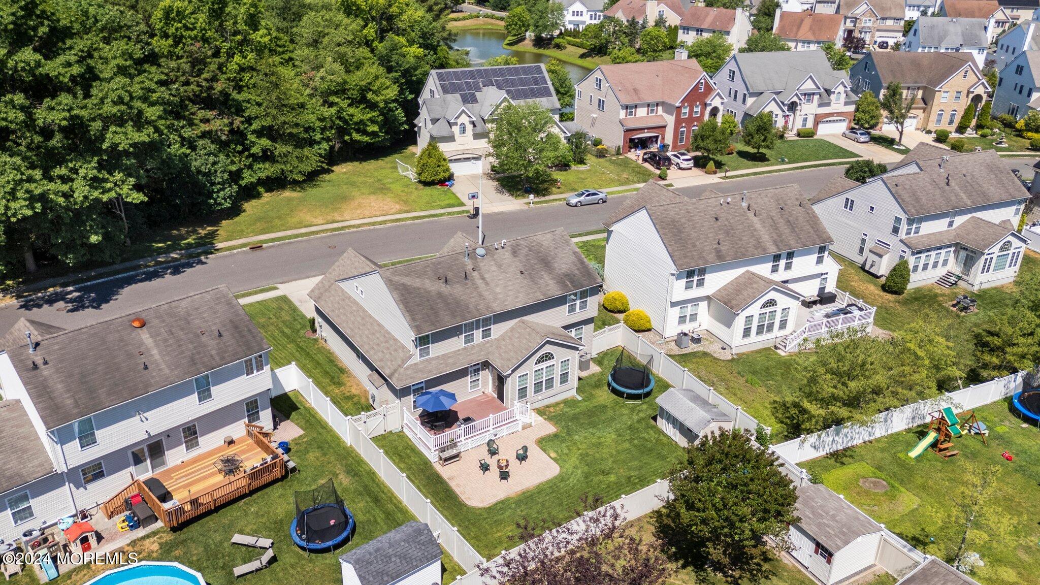 24 Firestone Drive Howell, NJ 07731 - Photo 66 of 70 an aerial view of residential house with outdoor space and swimming pool
