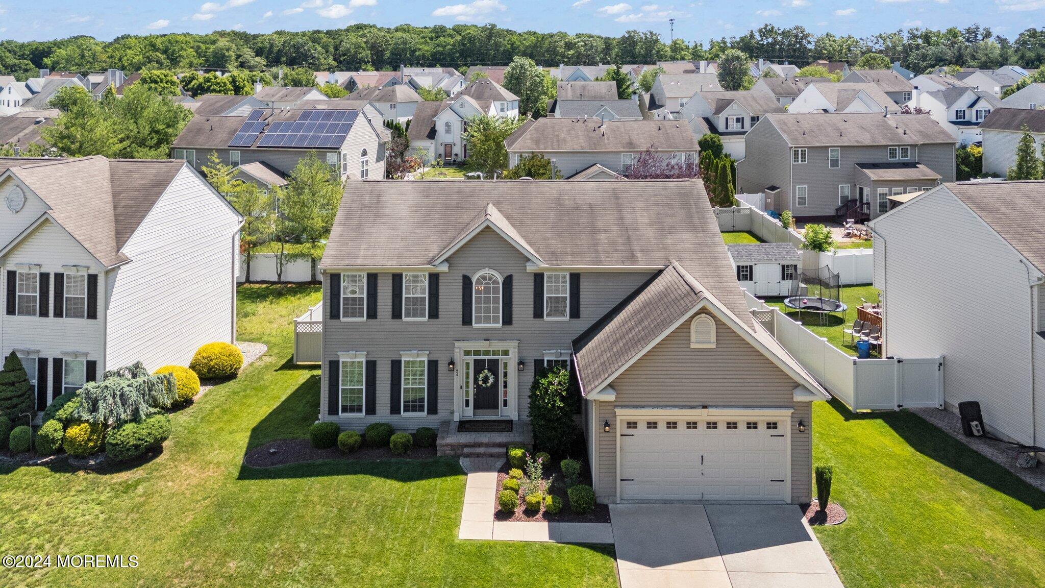 24 Firestone Drive Howell, NJ 07731 - Photo 68 of 70 an aerial view of a house with swimming pool and a yard