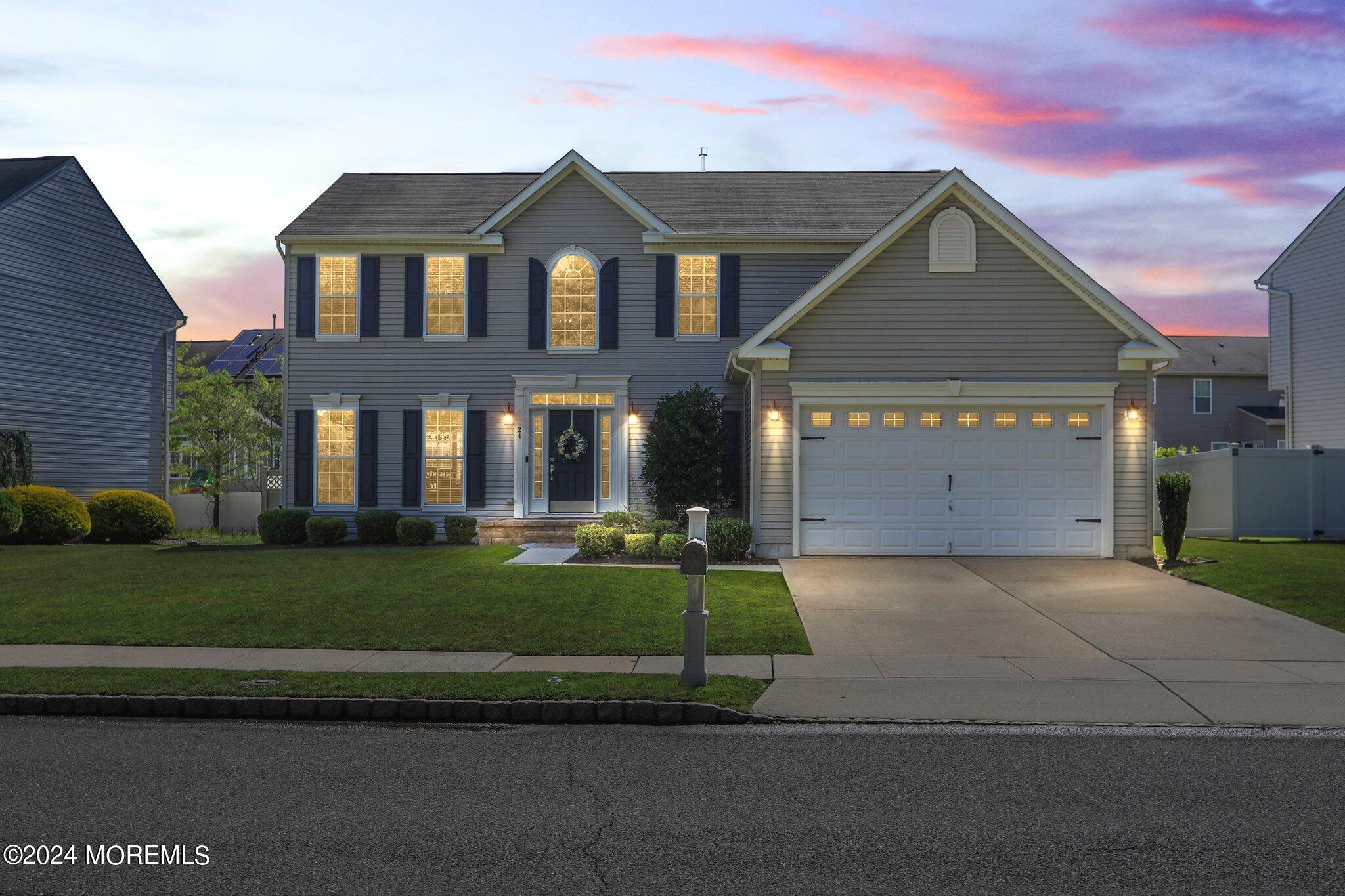24 Firestone Drive Howell, NJ 07731 - Photo 70 of 70 a front view of a house with a yard