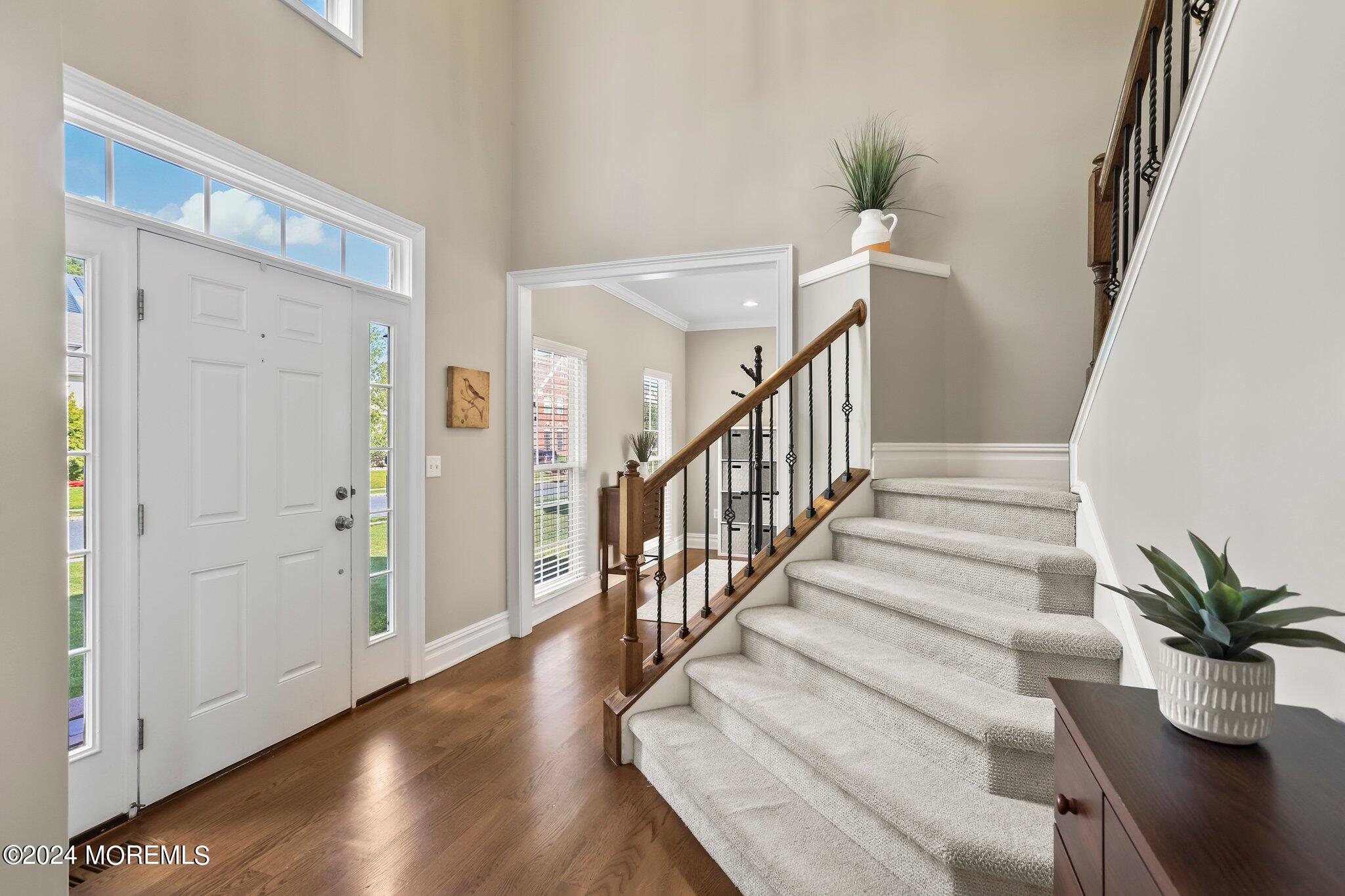 24 Firestone Drive Howell, NJ 07731 - Photo 8 of 70 a view of entryway and hall with wooden floor