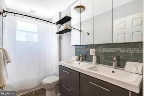 a bathroom with a sink toilet and vanity