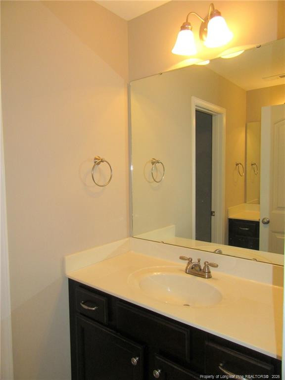 2142 Yates Ranch Road Hope Mills, NC 28348 - Photo 27 of 32 a bathroom with a sink and a mirror
