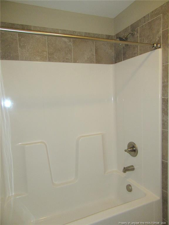 2142 Yates Ranch Road Hope Mills, NC 28348 - Photo 29 of 32 a bathroom with a shower and a bath tub