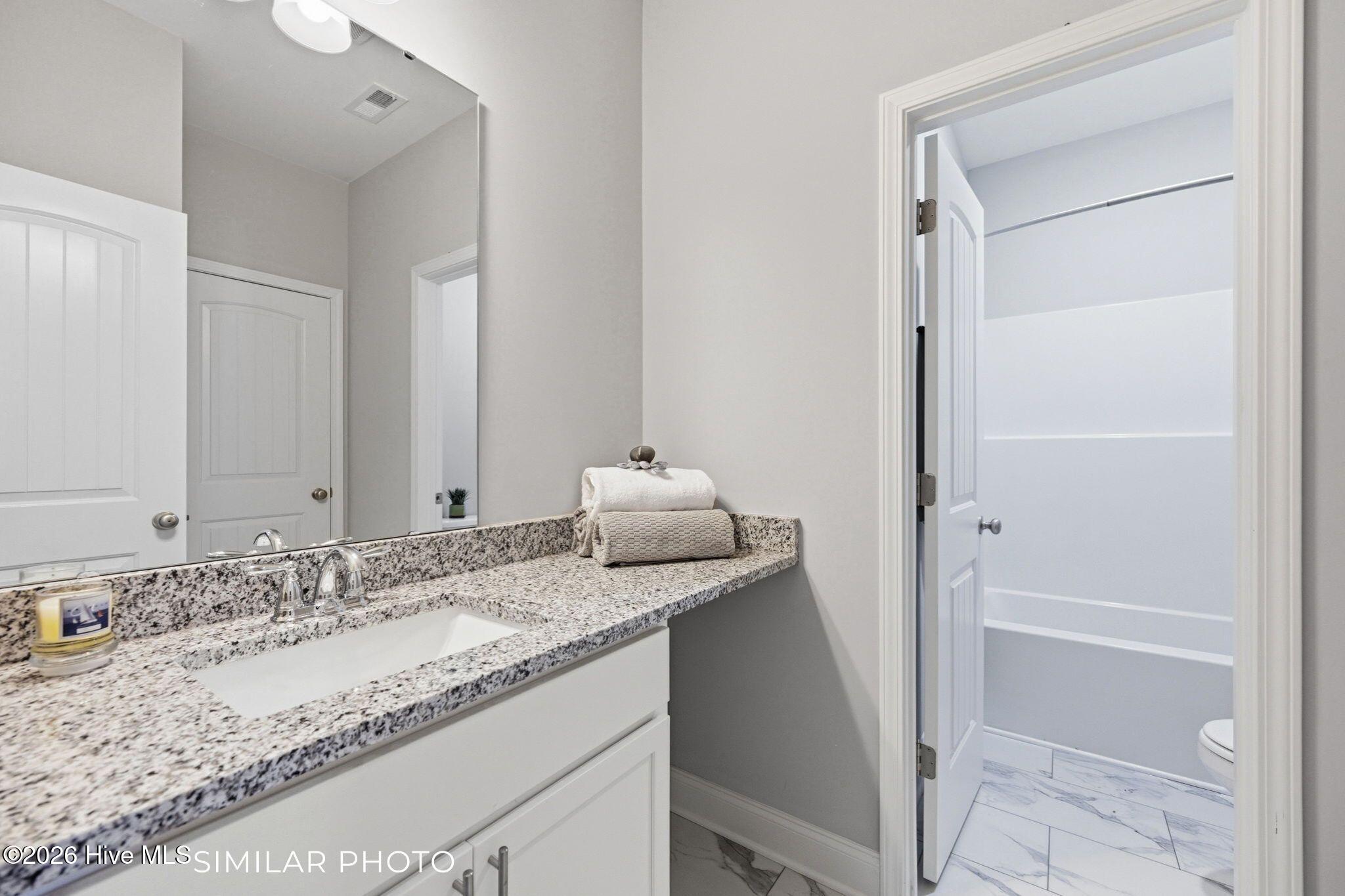 207 Holly Sands Loop Sneads Ferry, NC 28460 - Photo 31 of 45 Similar Photo - Guest Bathroom